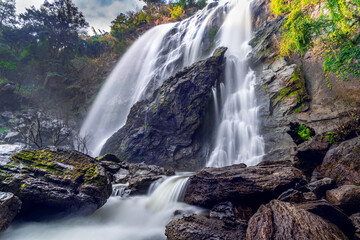 Obraz premium Beautiful waterfall stream at Khlong-Lan National Park,Kamphaeng phet province, Thailand.