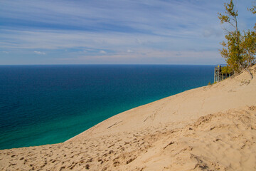 Massive sand dune and overlook on the coast of Lake Michigan at Sleeping Bear Dunes National Lakeshore in Michigan.