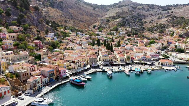 Aerial view of the beautiful greek island of Symi (Simi) with colourful houses and small boats. Greece, Symi island, view of the town of Symi (near Rhodes), Dodecanese.