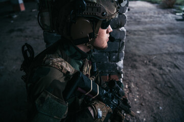 Soldier preparing tactical gear for action battle