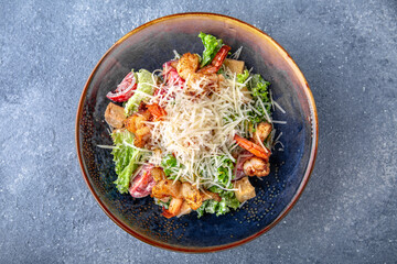 Pasta with seafood salmon, mussels in a creamy sauce. Natural delicious food. Greek cuisine menu. Still life in a marine style on a blue background.