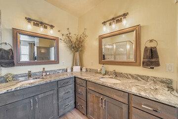 Bathroom interior of a beautiful house furnished with two sets of vanity areas