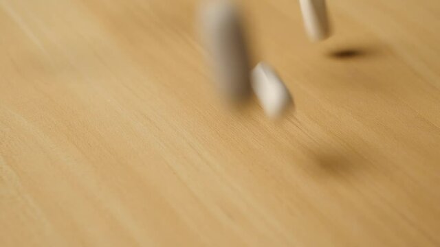 Close up of pills spilling in slow motion on tabletop