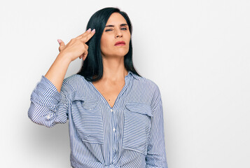 Young caucasian woman wearing casual clothes shooting and killing oneself pointing hand and fingers...