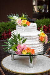 Obraz na płótnie Canvas Luxurious wedding or St. Valentine's naked cake decorated with fresh flowers