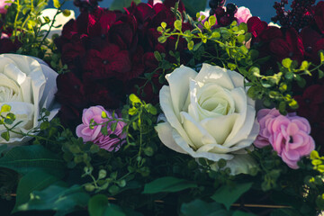 Burgundy and white bouquet of flowers with greenery
