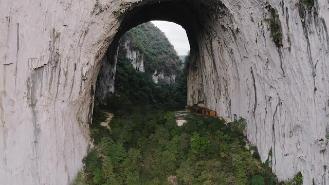 Iconic Great Arch of Getu, karst mountain rock climbing in China, aerial view