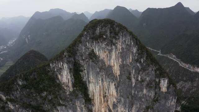 Steep karst mountain rock face, Getu Valley rock climbing region, China, aerial