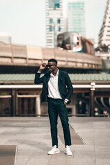 portrait of successful african businessman outdoor in modern city