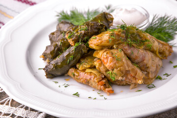 Dolma. Cabbage rolls. Rolls of rice with meat and vegetables wrapped in grape and cabbage leaves. Balkan cuisine. National cuisine. Nourishing, useful, natural. Rustic cuisine.