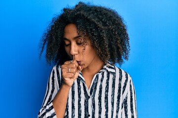 Beautiful african american woman with afro hair wearing casual clothes feeling unwell and coughing as symptom for cold or bronchitis. health care concept.