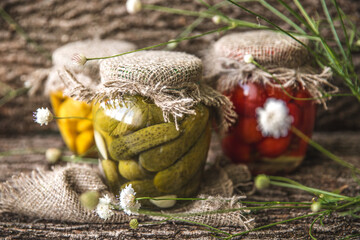 Rustic conservation. Assorted. Marinated tomatoes. Preserved marinated mushrooms. Green Peas and Baby Carrots. Crunchy pickles. Small yellow summer squash