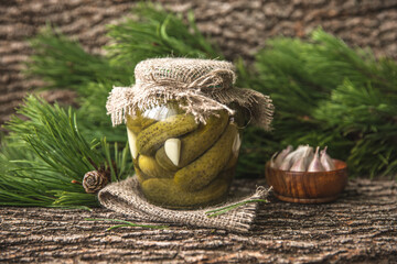 Preserved autumn vegetables. Delicious preserved crunchy pickles, in the glass jar. Rustic style