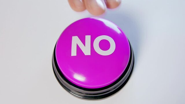 Woman pushing real No button. Concept of disagreement, rejection, refusal, denial, hate. 4k video for ads, promotion, negative review, feedback. User dislikes post on social media: bad, awful reaction