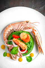 Langoustine, scallop, octopus, mussels, spinach puree. Italian restaurant. Menu. Free space for text