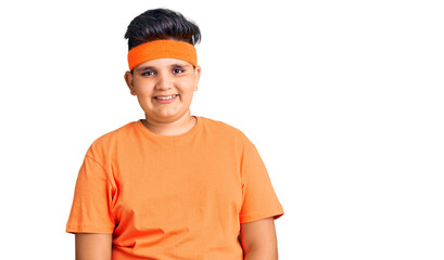 Little boy kid wearing sportswear winking looking at the camera with sexy expression, cheerful and...