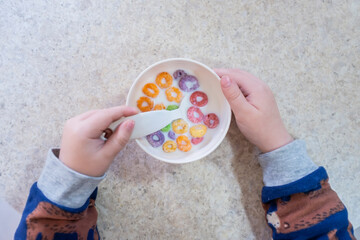 Kid eating cereal on breakfast