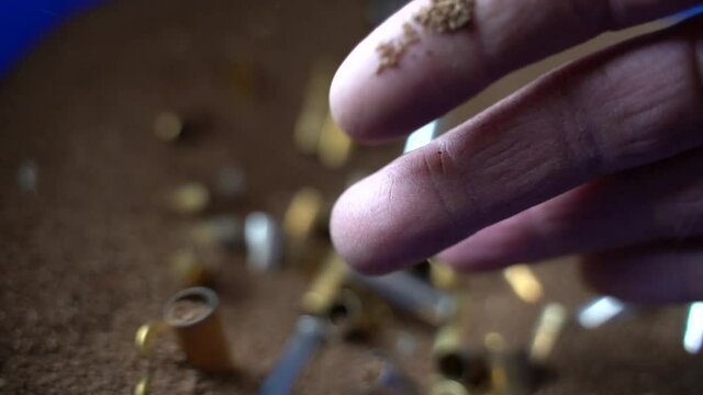 Bullet Ammo Brass being cleaned for reloading sifted and sorted by hand xcu.