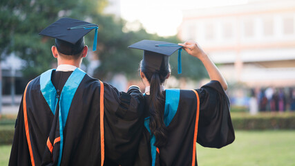 Rear view of the university graduates line up for degree award in university graduation ceremony....