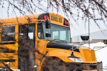 A parked school bus waiting for students