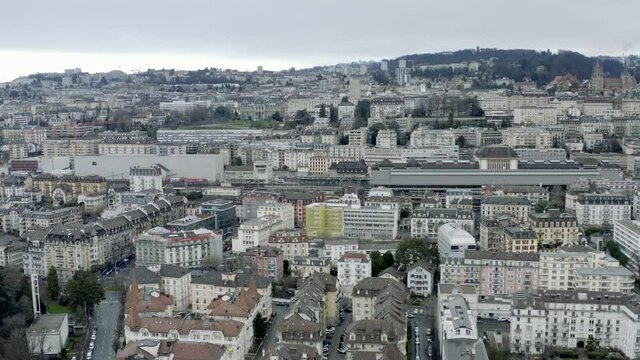 Drone Aerial of the beautiful swiss city center of lausanne located on the lake geneva (lac léman) in Switzerland during winter, Europe.