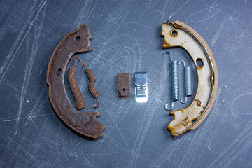 handbrake brake pad replacement concept, old rusty auto parts are new.
