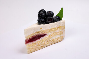 Blueberry cheese cake red berry jam stuffing on white background