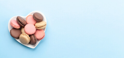 Valentines day with macaroons in heart shaped plate