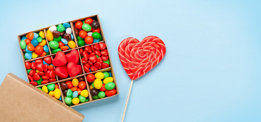 Various candy sweets and heart shaped lollipop. Valentines day gift box