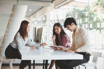 Creative ux ui designers designing screens for mobile responsive website development with UI/UX. Developing wireframe sketch layout design mockup on smartphone screen.