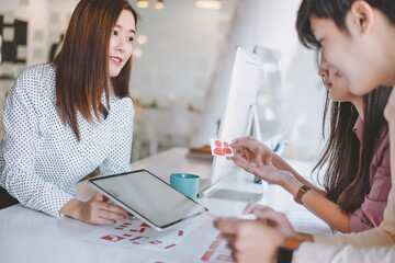 Creative ux ui designers designing screens for mobile responsive website development with UI/UX....