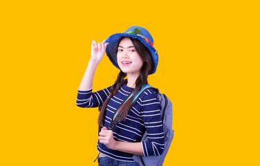 Asian woman tourist was running her to various places.happy excited emotional young woman photographer tourist standing isolated over Orange background
