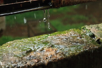 Heavy rain outdoors. Water droplets splashing from the bricks. Heavy rain