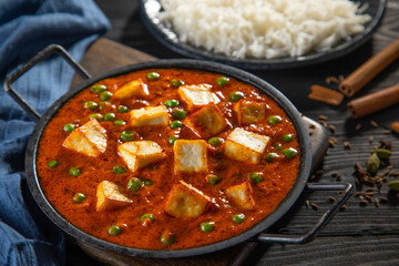 Mattar Paneer or cottage cheese with Peas with cooked steamed  rice in the background 	