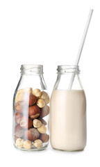 Bottles of hazelnut milk isolated on white background