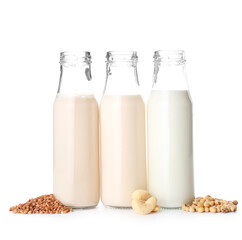 Bottles of different milk isolated on white background