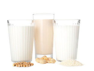 Glasses of different milk isolated on white background