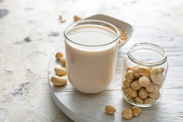 Glass of hazelnut milk on table