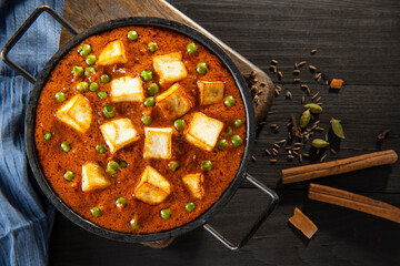 Mattar Paneer or cottage cheese with Peas. A vegetarian Indian delicacy 	