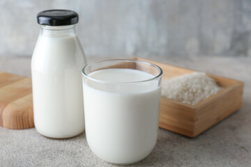 Glassware with tasty rice milk on table