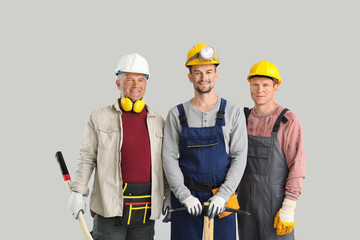 Miner men on grey background
