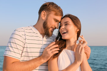 Happy young couple on sea beach