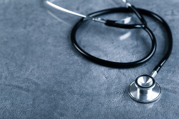 Black stethoscope for doctor diagnostic coronavirus disease, medical tool for health on blue...