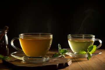 green tea with mint leaf on wooden table	