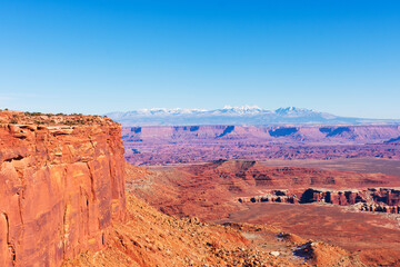 Scenic view of Colorado river canyon from Grand View Point Trail. The La Sal Mountains in the distance at Canyonlands National Park