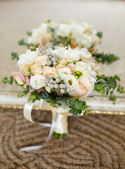 Obraz na płótnie Canvas Wedding bouquet from pretty roses