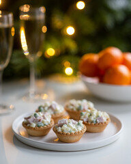 Traditional Russian salad Olivier in tartlets and Christmas decorations