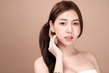 Asian beauty woman with natural makeup, cosmetic and plastic surgery concept, Isolated mocha brown background