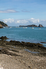  Fishing boats and yachts moored in the bay at high tide in Cancale, famous oysters production town. Brittany, France,