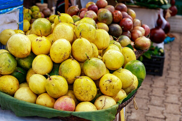 Passion fruits in fresh banana leaves and basket at street food in Thailand